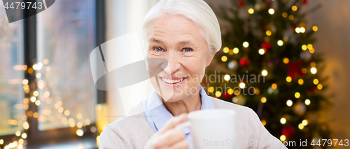 Image of happy senior woman with cup of coffee