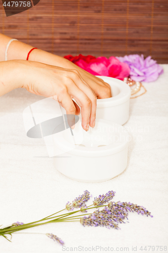 Image of Preparing a woman\'s hands for a manicure