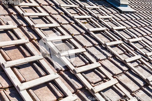 Image of renovation of a brick tiled roof