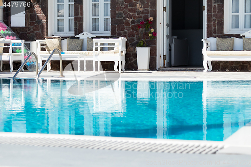 Image of private pool and sun loungers in the sun