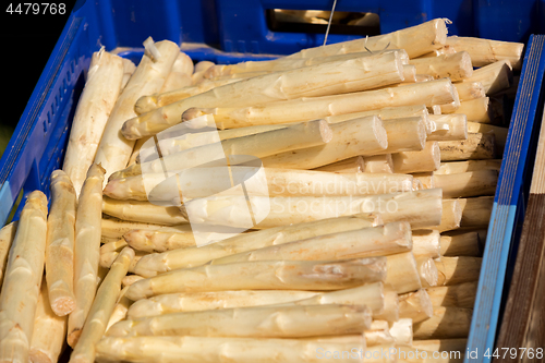 Image of crate of fresh white asparagus on a market