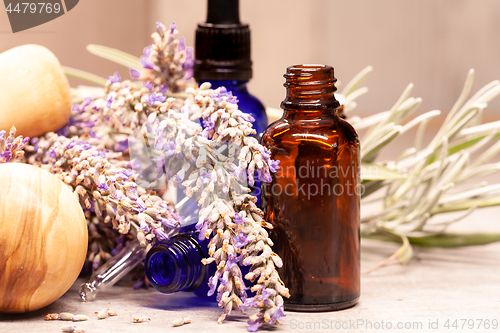 Image of lavender mortar and pestle and bottles of essential oils for aro