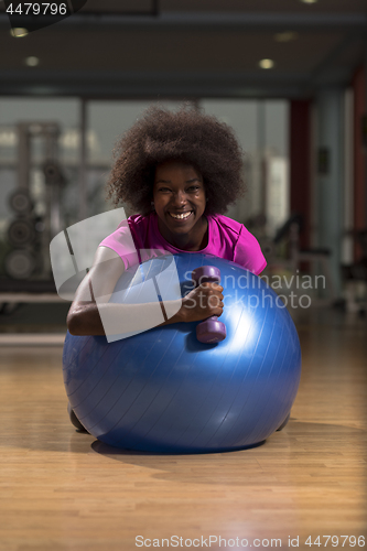 Image of woman  relaxing after pilates workout