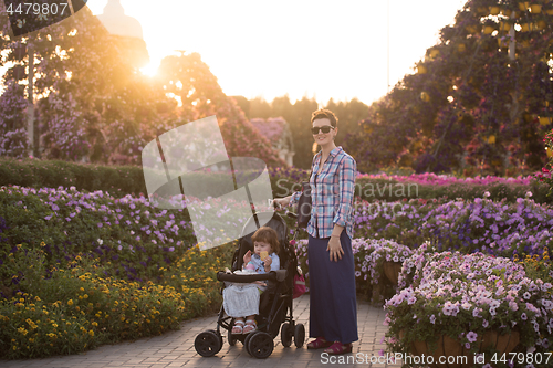 Image of mother and daughter in flower garden