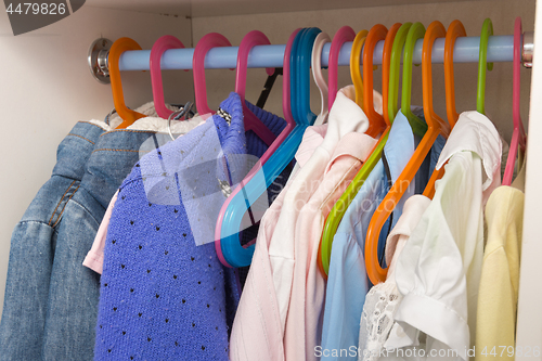 Image of Baby things weigh on hangers