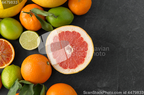 Image of close up of citrus fruits on stone table