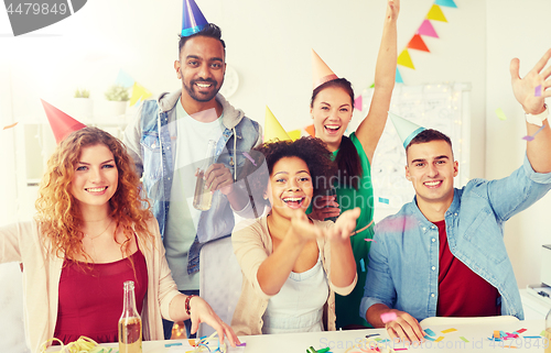 Image of happy team having fun at office party