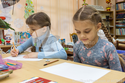 Image of Schoolgirls at their desks in drawing class