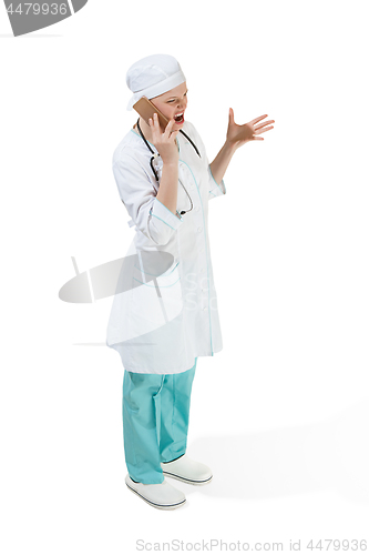 Image of Beautiful young woman in white coat posing at studio. Full length studio shot isolated on white.