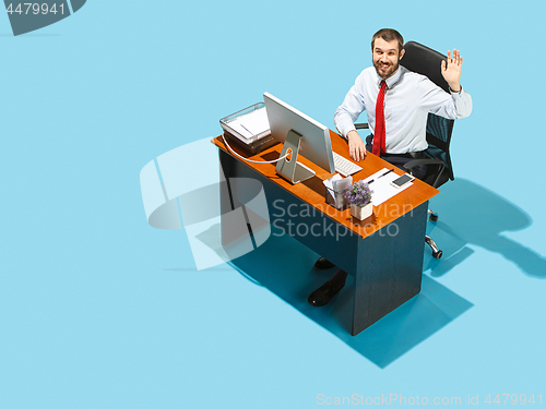 Image of Shot from above of a stylish business man working on a laptop.