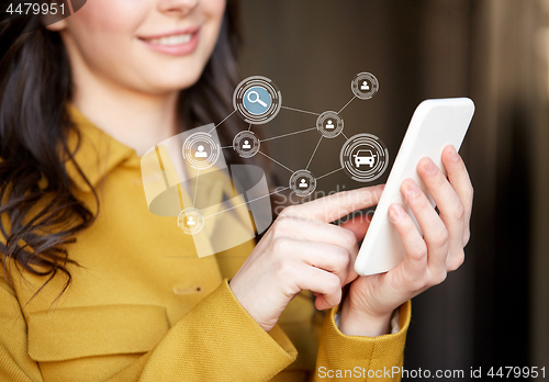 Image of teenage girl using car sharing app on smartphone