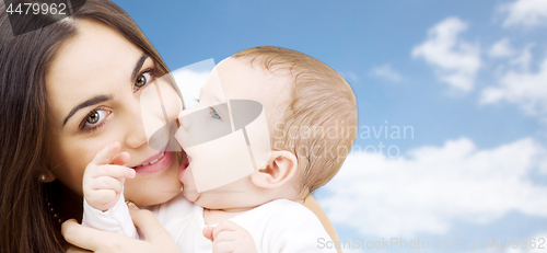 Image of mother with baby over sky background