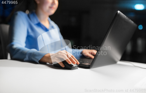 Image of close up of businesswoman using computer mouse