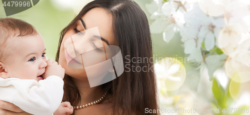 Image of mother with baby over cherry blossom background