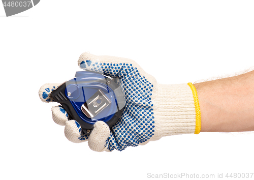 Image of Hand with glove and tape measure