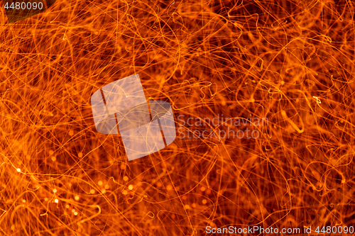 Image of Sparks flying on black background