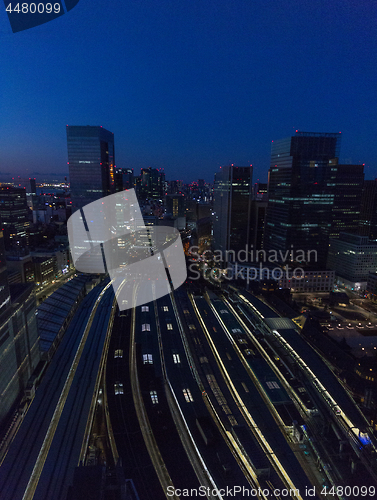 Image of view of night railway station in tokyo city, japan