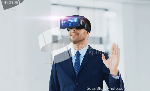 Image of businessman with virtual reality headset at office