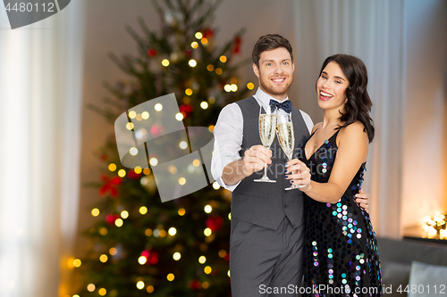 Image of couple with champagne glasses at christmas party