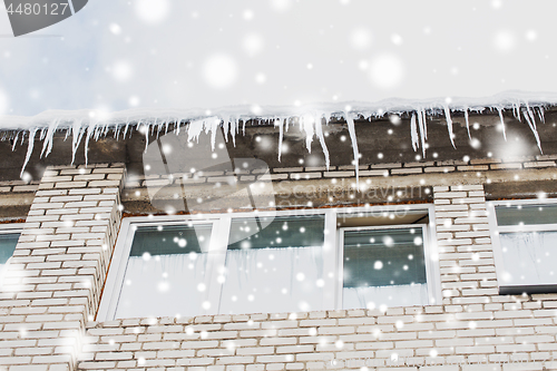 Image of icicles on building or living house facade