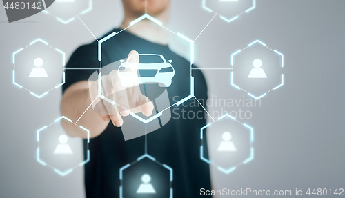 Image of businessman with virtual hologram of car sharing