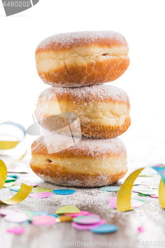 Image of Krapfen, Berliner or  donuts with streamers and confetti