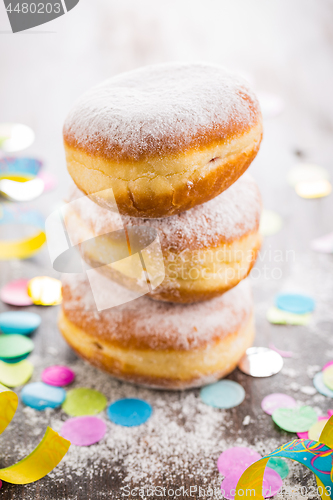 Image of Krapfen, Berliner or  donuts with streamers and confetti