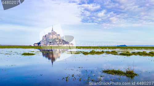 Image of Mont-Saint-Michel reflecting in blue