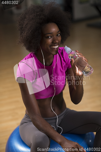 Image of woman  relaxing after pilates workout