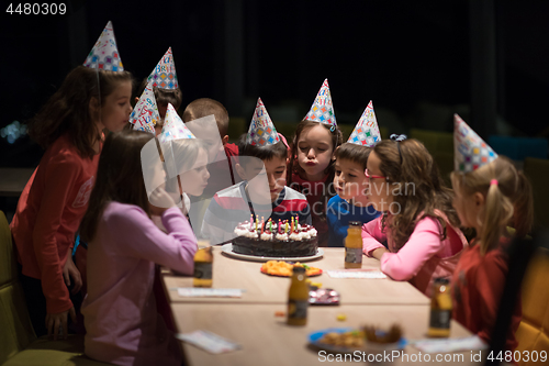 Image of The young boy joyfully celebrating his birthday