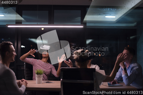 Image of Multiethnic Business team using virtual reality headset