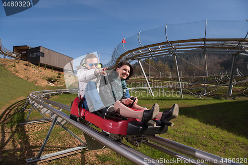 Image of couple enjoys driving on alpine coaster