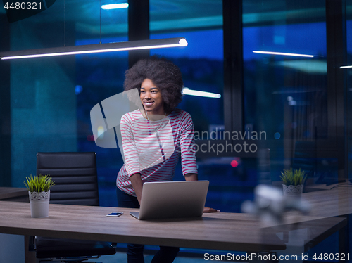 Image of black businesswoman using a laptop in startup office