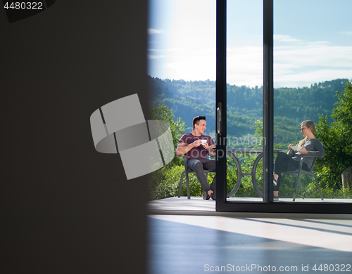 Image of couple enjoying morning coffee and breakfast