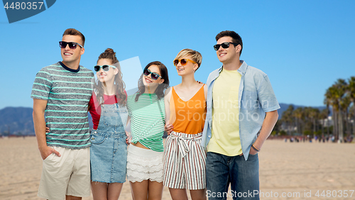 Image of happy friends over venice beach background