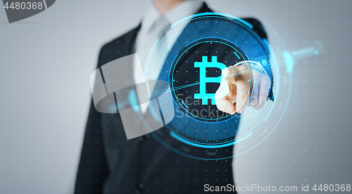 Image of close up of businessman with bitcoin hologram