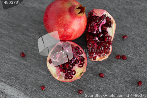 Image of close up of pomegranate on stone table