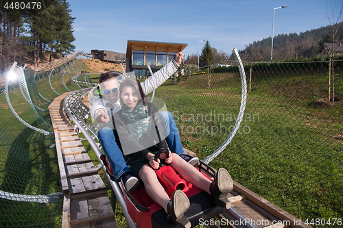 Image of couple enjoys driving on alpine coaster