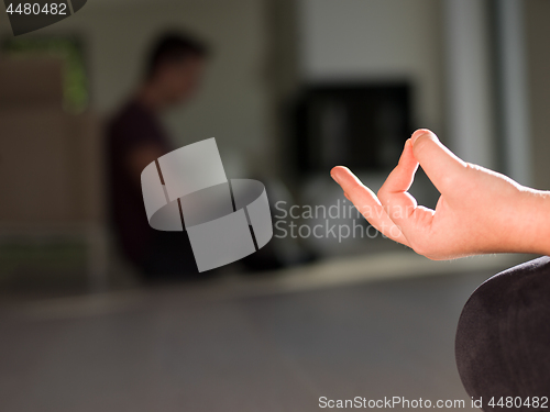 Image of young woman doing morning yoga exercises