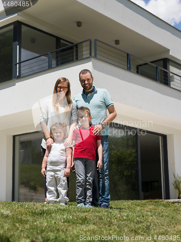 Image of happy family with children in the yard