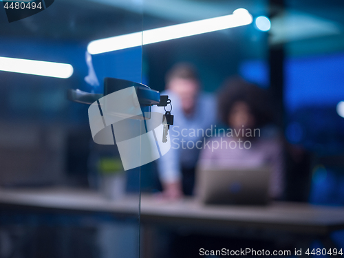 Image of Multiethnic startup business team in night office