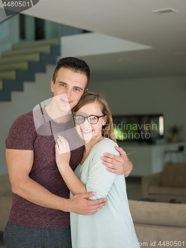 Image of couple hugging in their new home