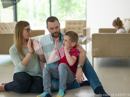 Image of family with little boy enjoys in the modern living room