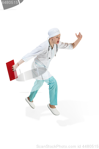 Image of Beautiful young woman in white coat running at studio. Full length studio shot isolated on white.