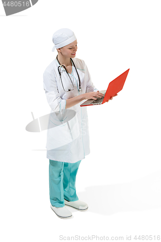 Image of Beautiful young woman in white coat posing at studio. Full length studio shot isolated on white.