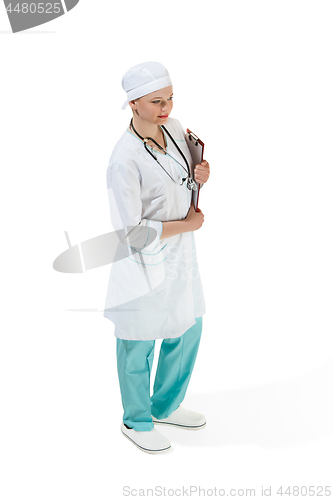 Image of Beautiful young woman in white coat posing at studio. Full length studio shot isolated on white.