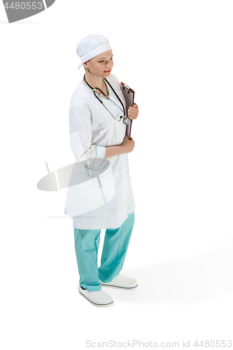 Image of Beautiful young woman in white coat posing at studio. Full length studio shot isolated on white.