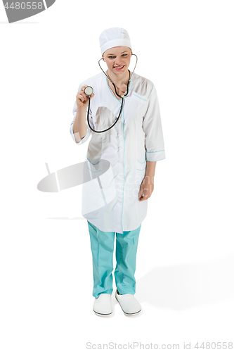 Image of Beautiful young woman in white coat posing at studio. Full length studio shot isolated on white.