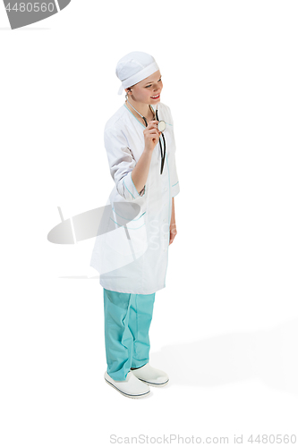 Image of Beautiful young woman in white coat posing at studio. Full length studio shot isolated on white.