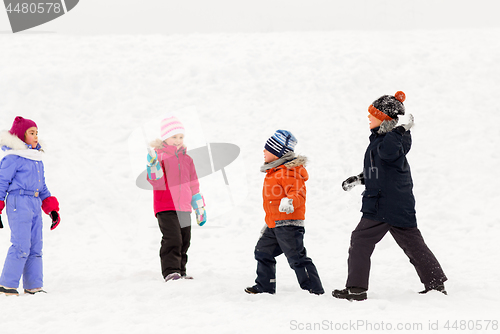 Image of happy little kids playing outdoors in winter